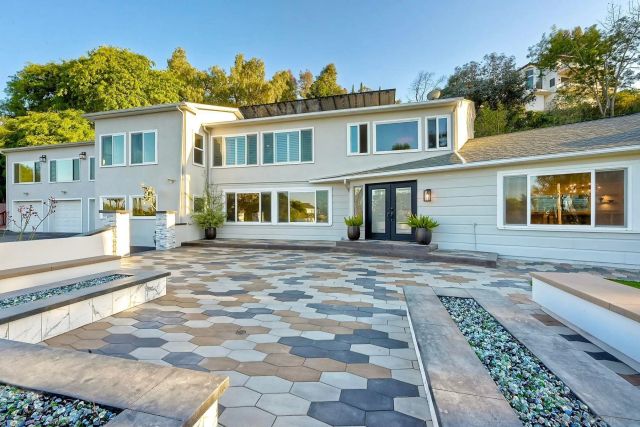 a view of a swimming pool with a patio