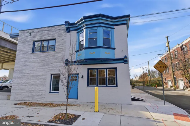 a front view of a house with street
