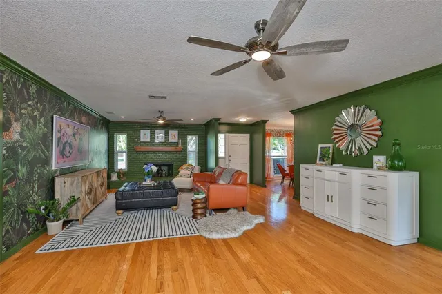 a living room with furniture fireplace and flat screen tv
