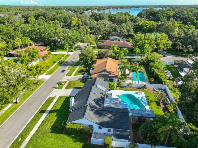 an aerial view of residential houses with outdoor space