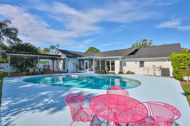 a dining room with furniture a rug and wooden floor