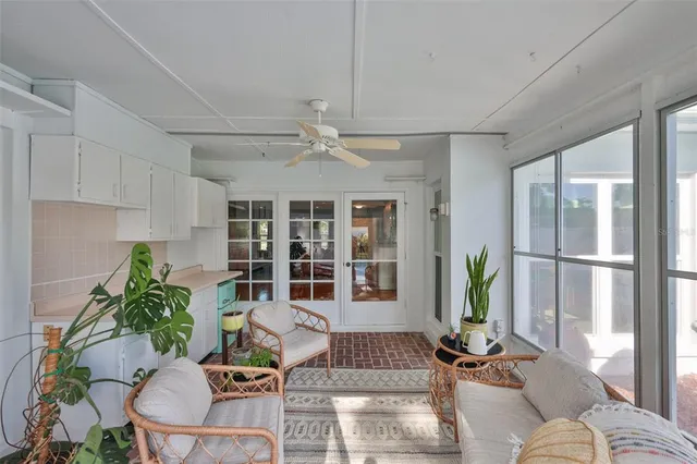 a kitchen with stainless steel appliances granite countertop a sink dishwasher and a refrigerator with the cabinets