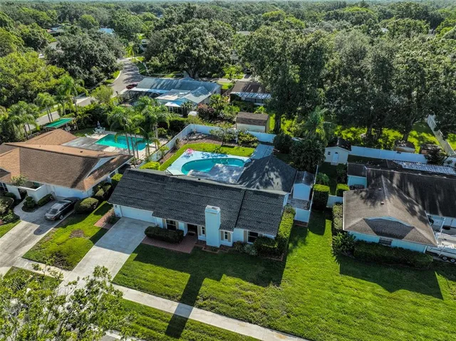a kitchen with a sink appliances and cabinets