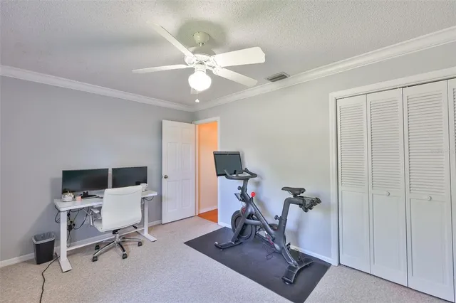 an aerial view of a houses with a yard