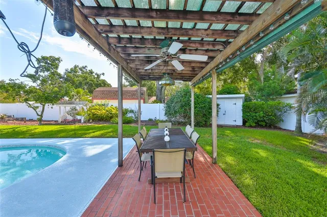 an aerial view of a houses with a yard