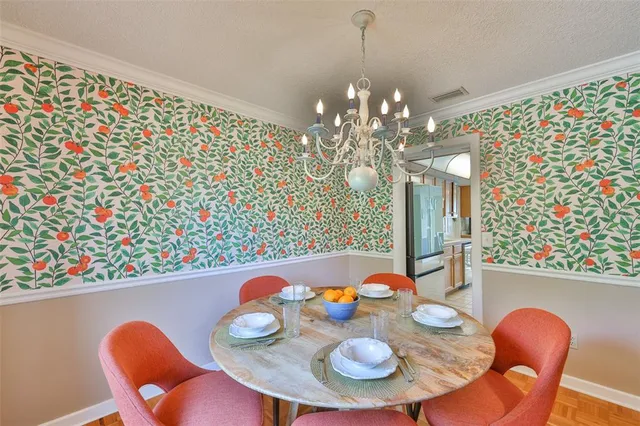 a dining room with furniture and wooden floor