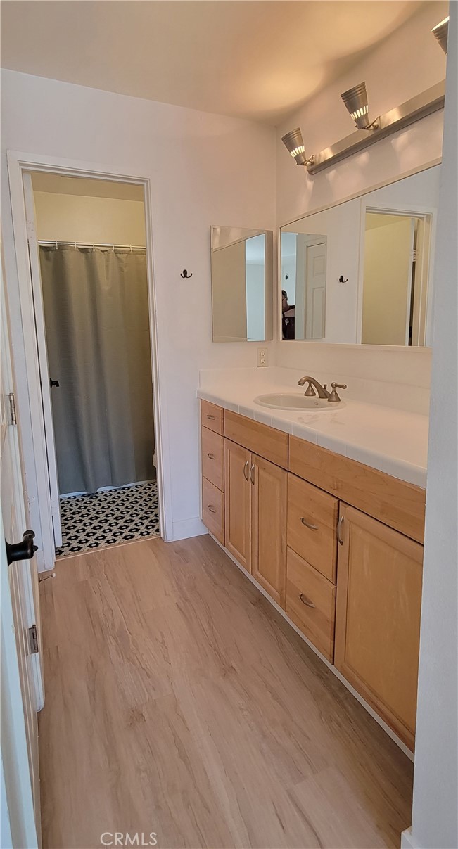 8740 Tuscany Avenue Playa del Rey, CA 90293 - Photo 14 of 21 a bathroom with a sink and a mirror