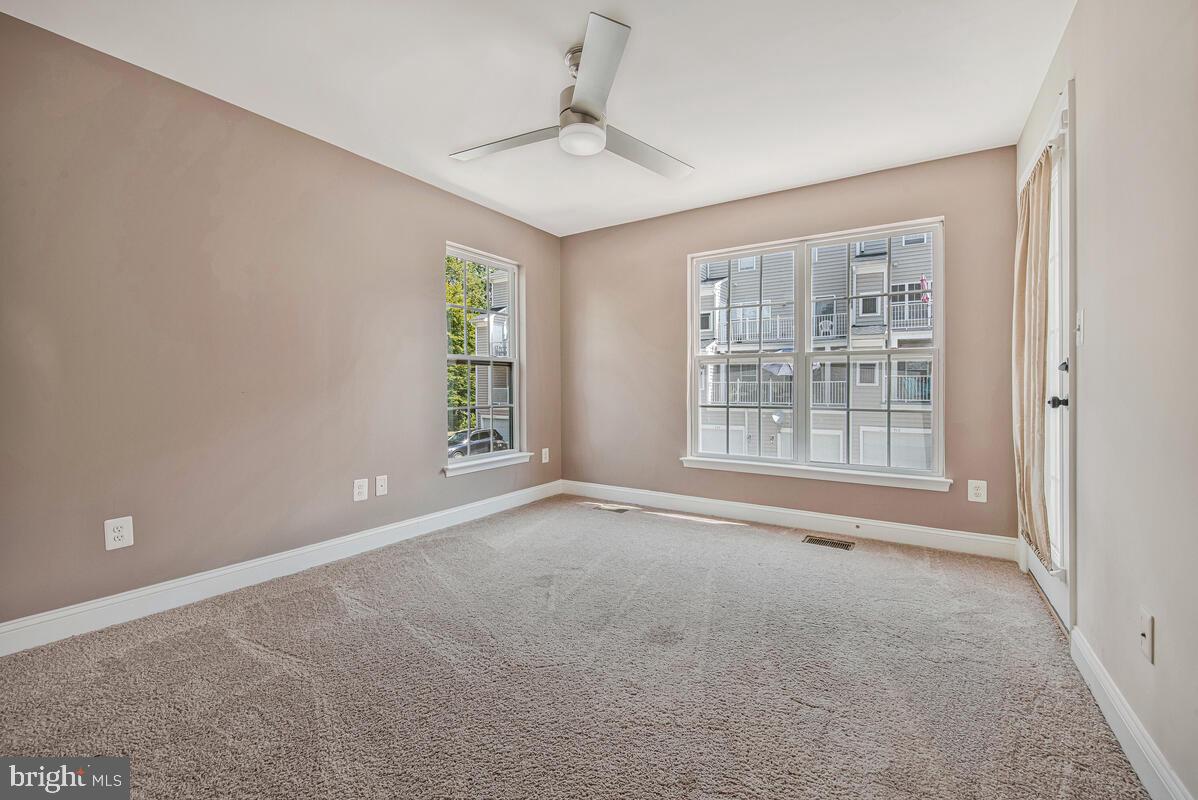 12354 Rollys Ridge Avenue, Unit 2201 Upper Marlboro, MD 20774 - Photo 13 of 20 a view of an empty room with a window