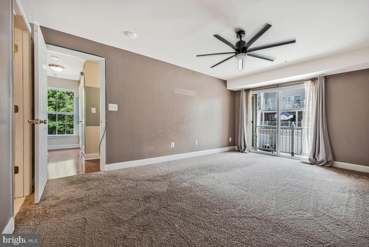 12354 Rollys Ridge Avenue, Unit 2201 Upper Marlboro, MD 20774 - Photo 16 of 20 a view of an empty room with a window