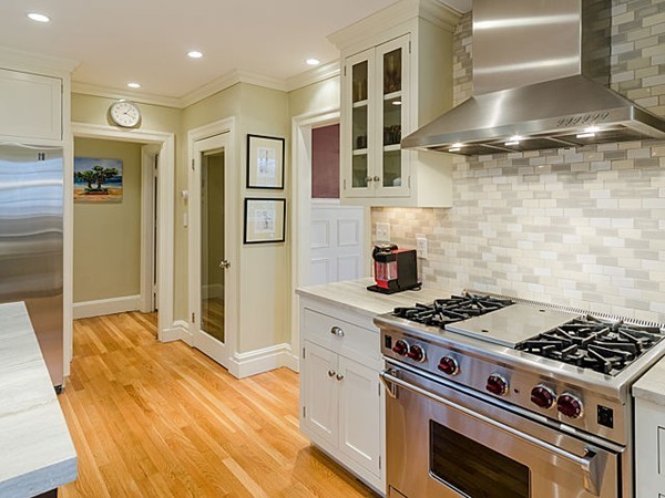 35 Bothfeld Road Newton, MA 02459 - Photo 8 of 25 a kitchen with stainless steel appliances granite countertop a stove and a refrigerator