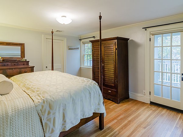 35 Bothfeld Road Newton, MA 02459 - Photo 10 of 25 a spacious bedroom with a bed and wooden floor