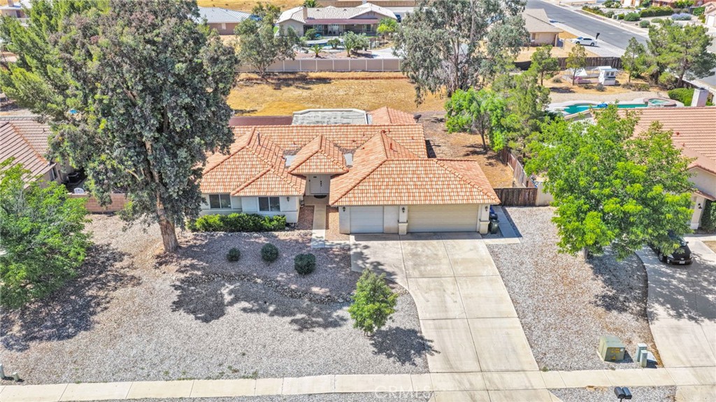 20403 Ochoa Road Apple Valley, CA 92307 - Photo 43 of 48 a view of a house with a yard and sitting area