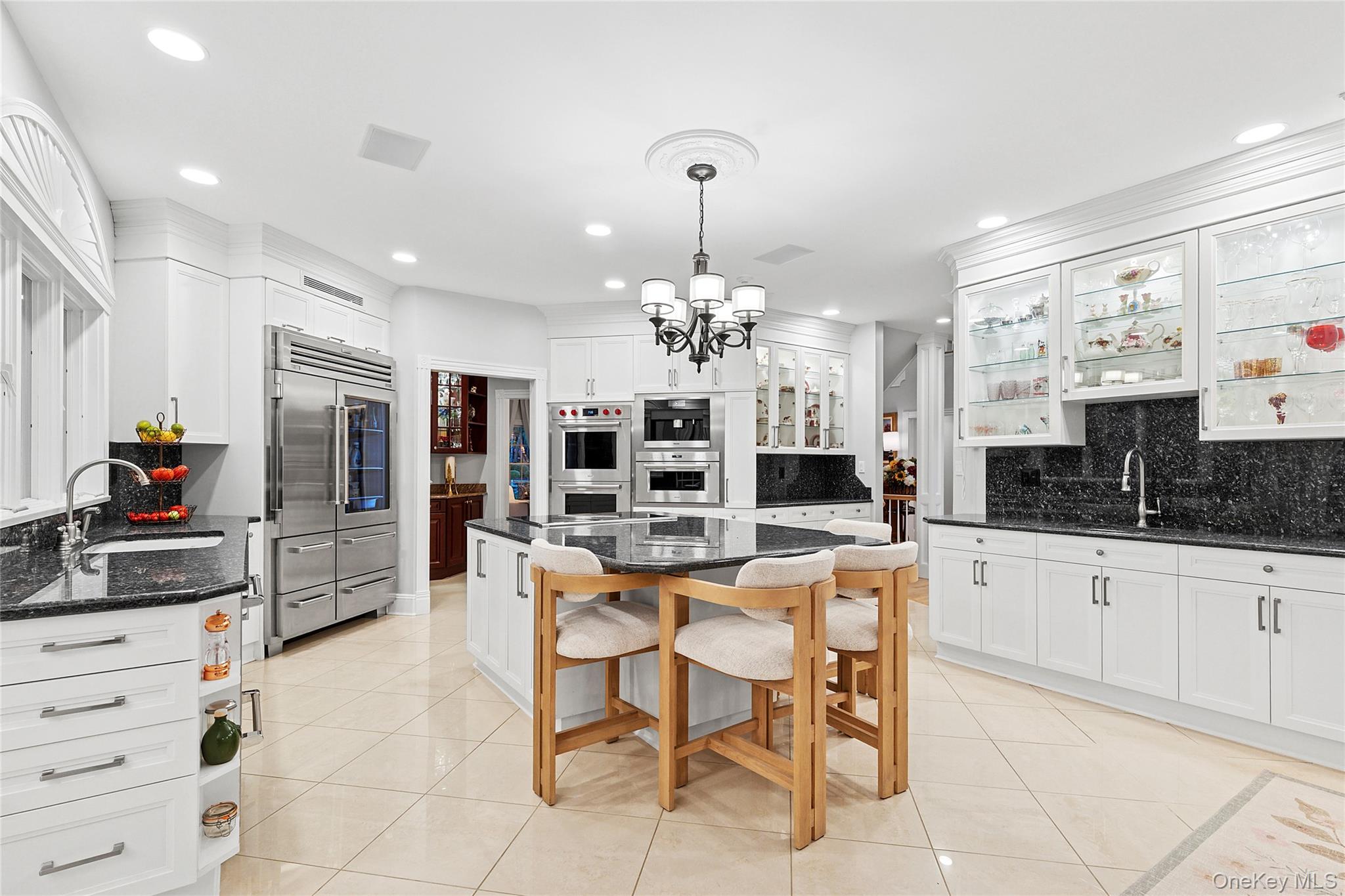 2 North Harbor Down Miller Place, NY 11764 - Photo 11 of 49 a kitchen with stainless steel appliances kitchen island granite countertop a sink and cabinets