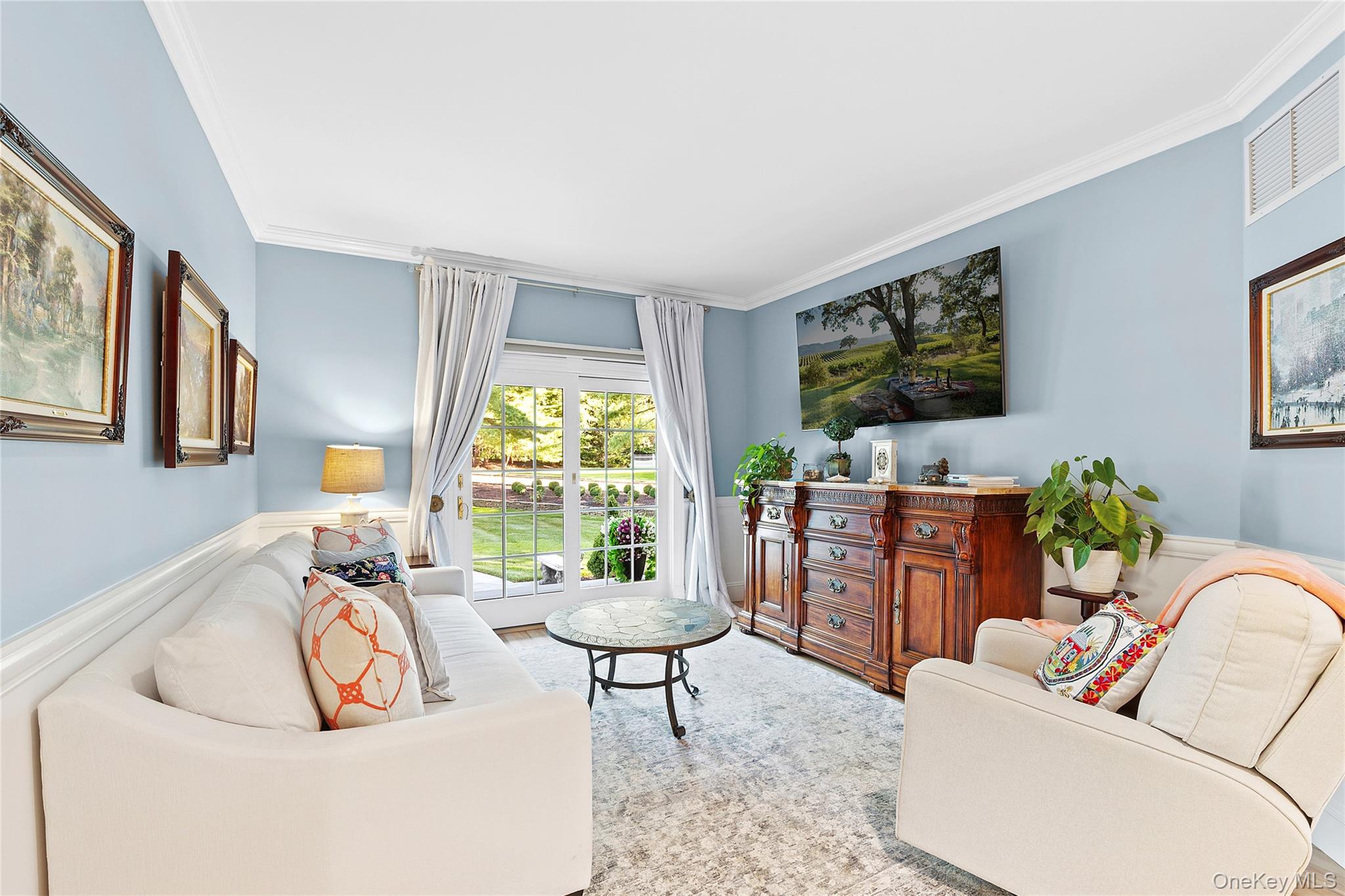 2 North Harbor Down Miller Place, NY 11764 - Photo 22 of 49 a living room with furniture a flat screen tv and a floor to ceiling window
