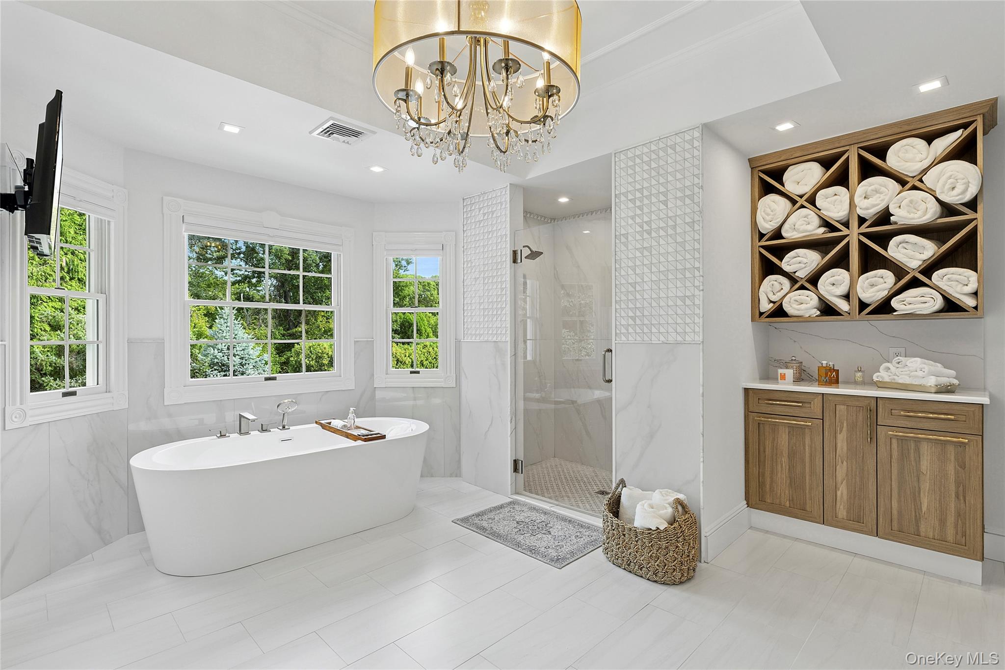 2 North Harbor Down Miller Place, NY 11764 - Photo 29 of 49 a spacious bathroom with a double vanity sink a bathtub and shower