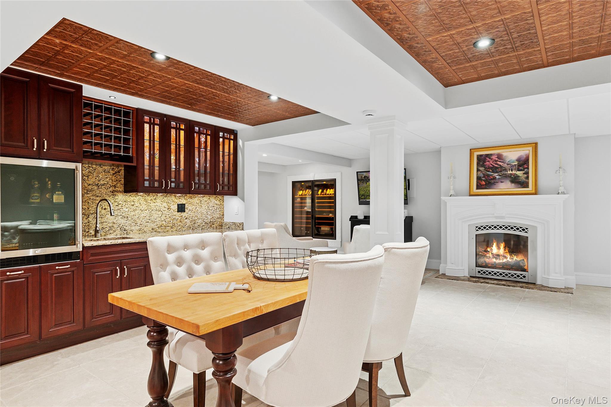 2 North Harbor Down Miller Place, NY 11764 - Photo 35 of 49 a living room with a table chairs and a fireplace