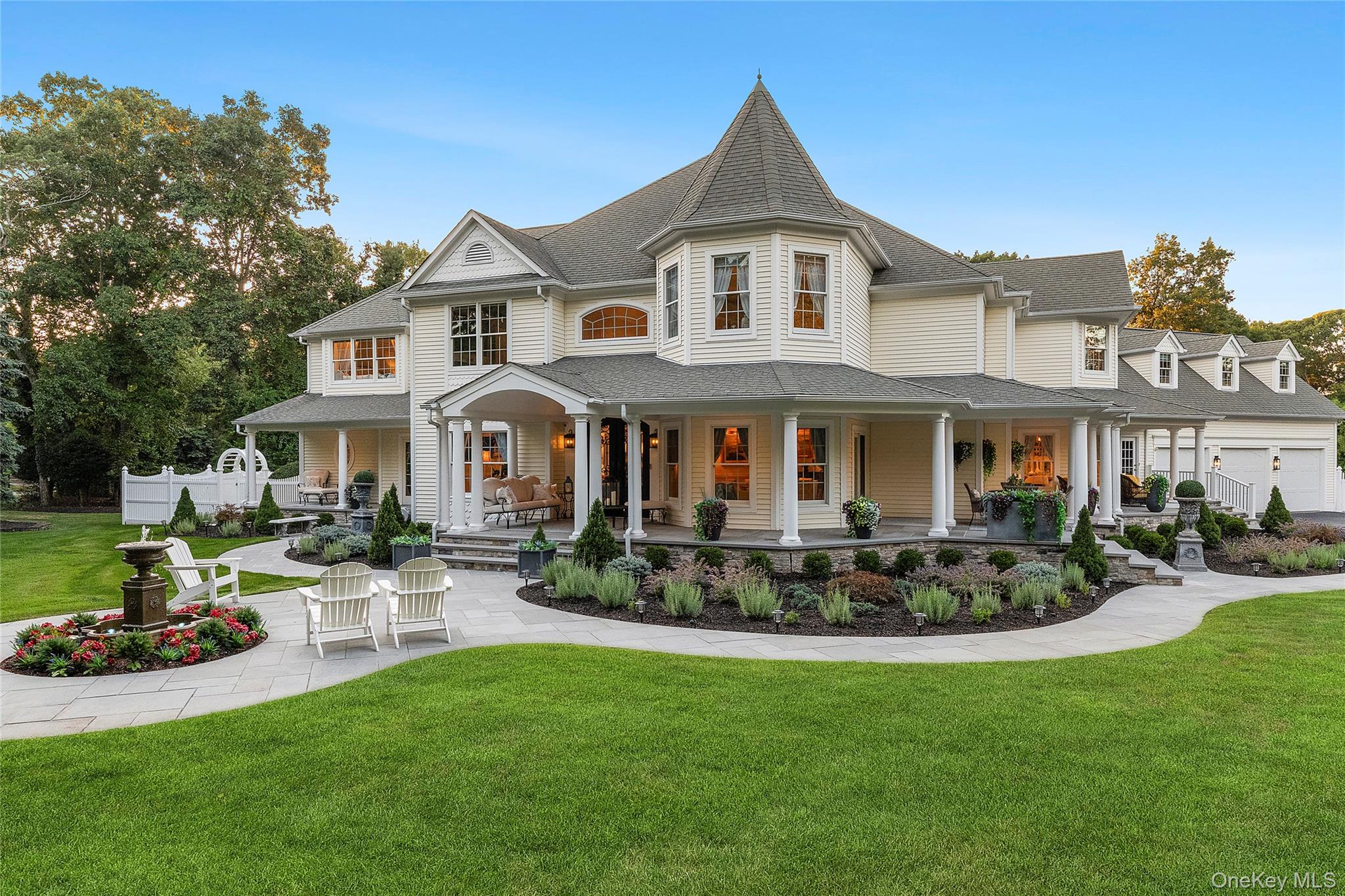 2 North Harbor Down Miller Place, NY 11764 - Photo 6 of 49 a front view of a house with a yard table and chairs
