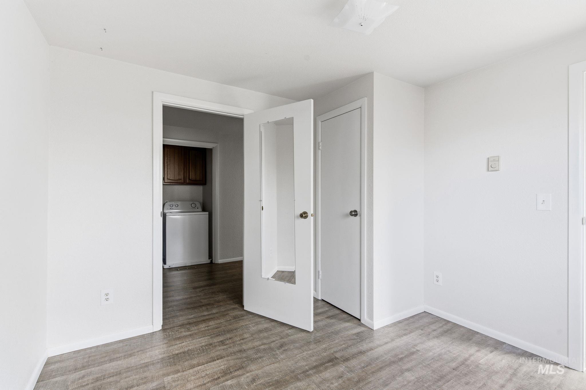 3911 South Constitution Way Boise, ID 83706 - Photo 19 of 40 Unfurnished bedroom with washer / dryer and light wood-type flooring