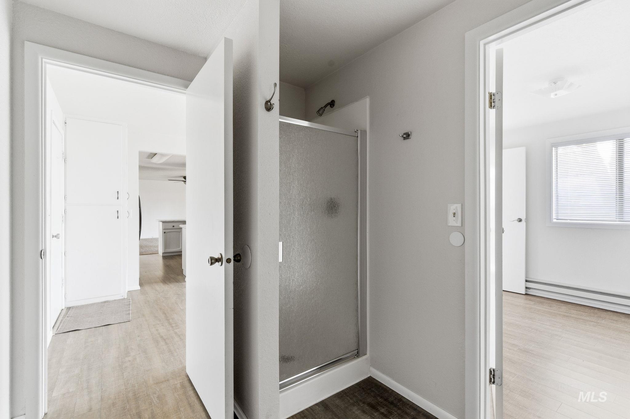 3911 South Constitution Way Boise, ID 83706 - Photo 22 of 40 Full bath with a stall shower and light wood-style flooring