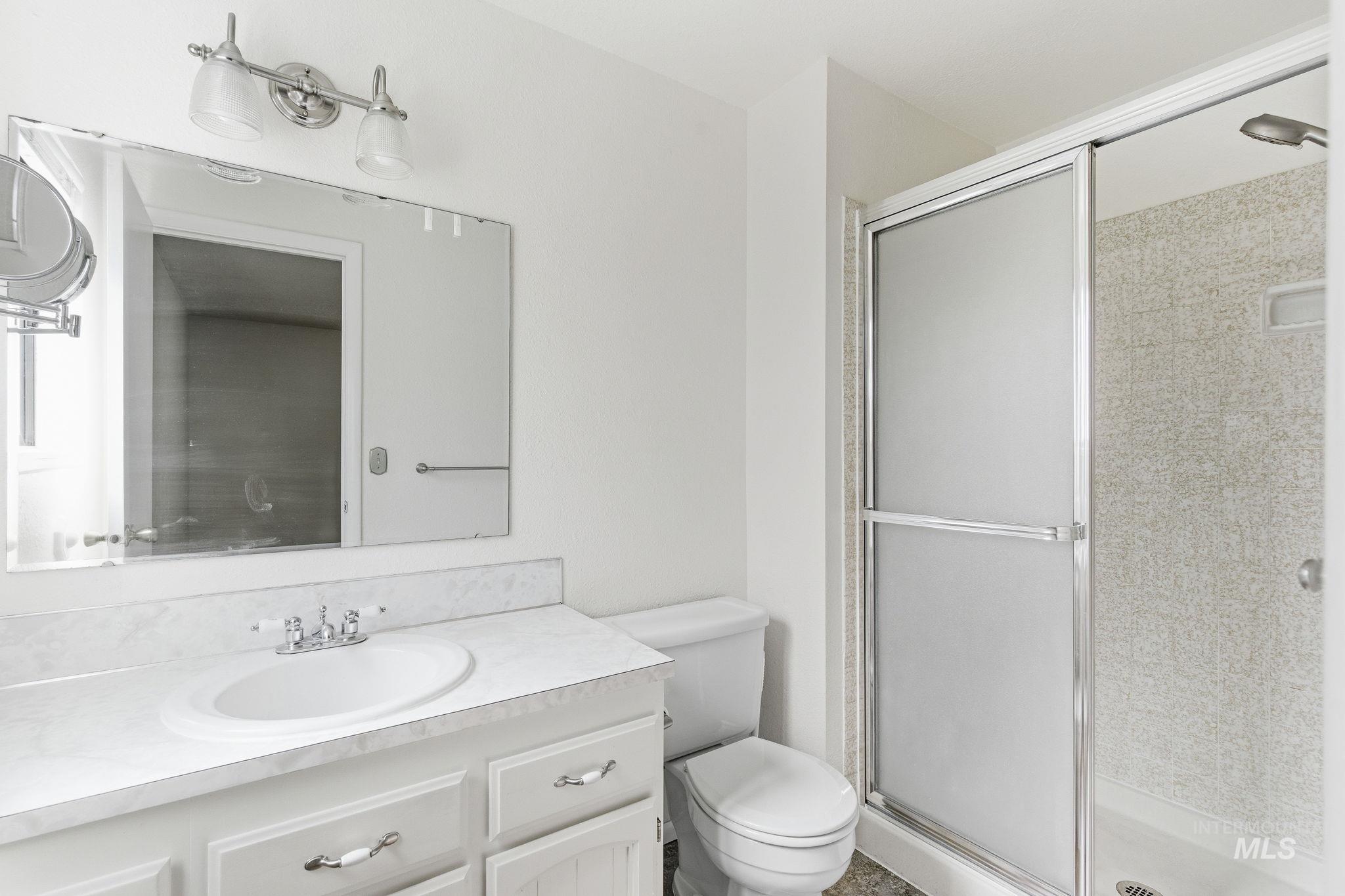 3911 South Constitution Way Boise, ID 83706 - Photo 29 of 40 Full bathroom with vanity and a shower stall