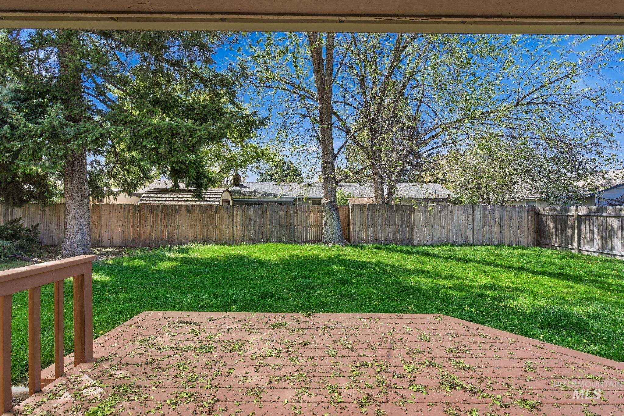 3911 South Constitution Way Boise, ID 83706 - Photo 39 of 40 Fenced backyard featuring a wooden deck