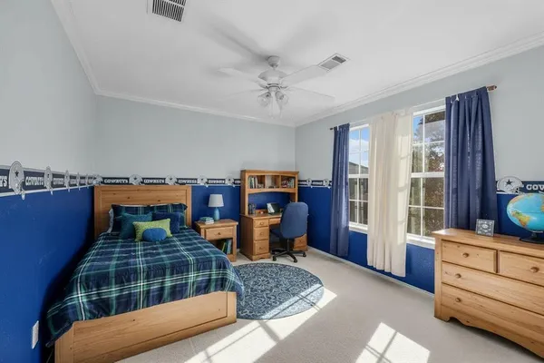 a bedroom with furniture and window