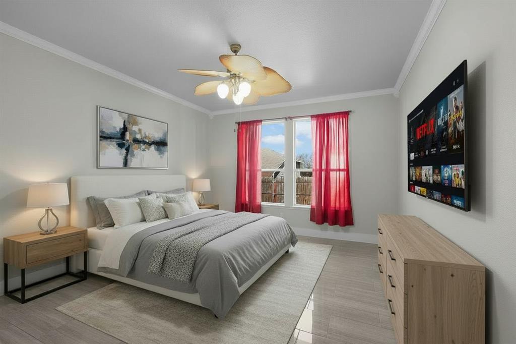 3625 Black Ranch Court Fort Worth, TX 76262 - Photo 20 of 30 a bedroom with a large bed and a flat screen tv