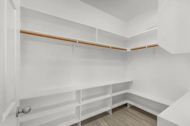 a view of an empty walk in closet