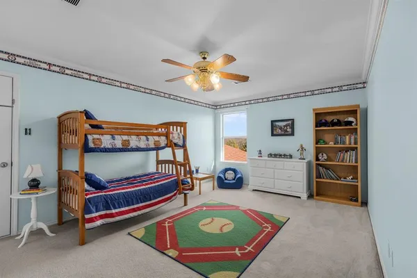 a bedroom with furniture and window