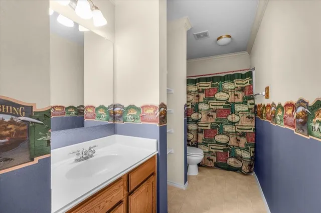 a bathroom with a sink double vanity and a mirror