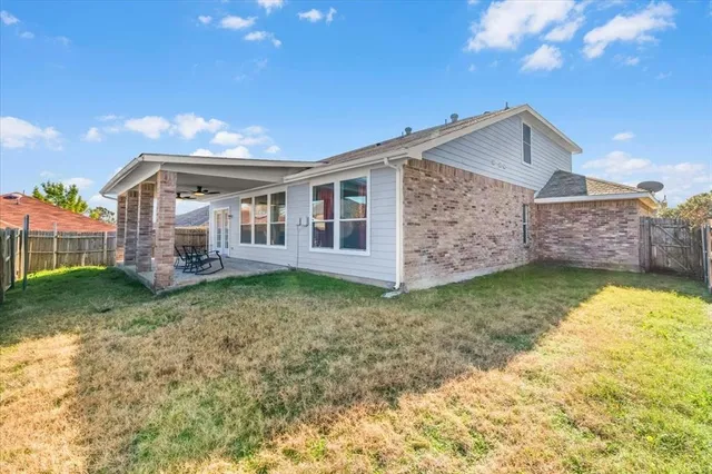 a view of roof deck with wooden fence