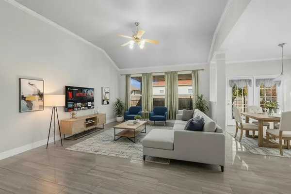 a living room with furniture and a flat screen tv