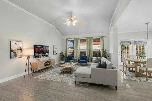 a living room with furniture and a flat screen tv