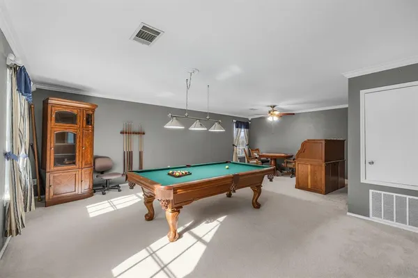 a room with furniture and gym equipment