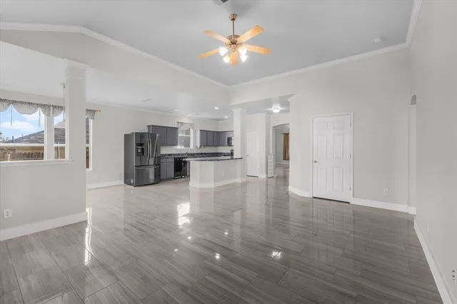 a view of kitchen with refrigerator stove microwave and cabinets