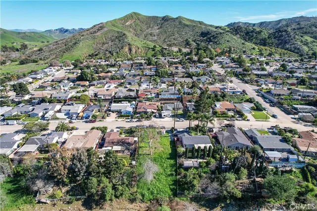an aerial view of residential houses and city view