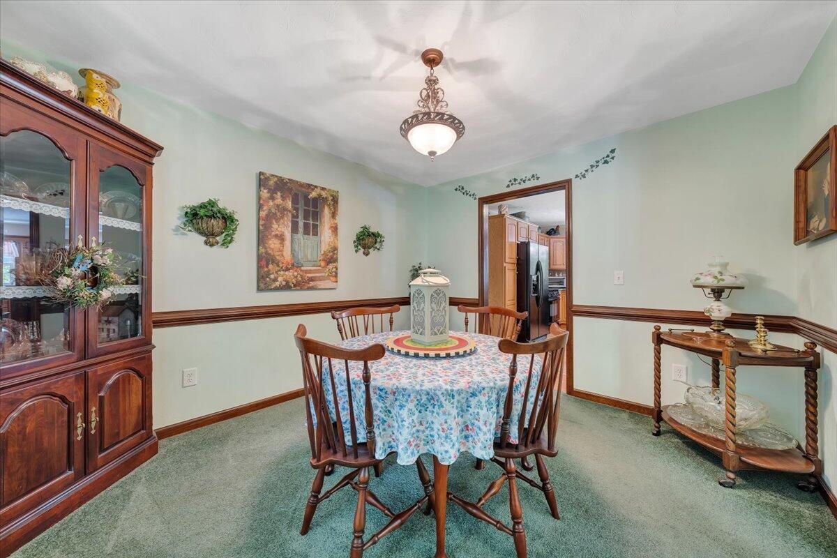 4081 Daugherty Road Salem, VA 24153 - Photo 7 of 34 a view of a dining room with furniture and a chandelier fan