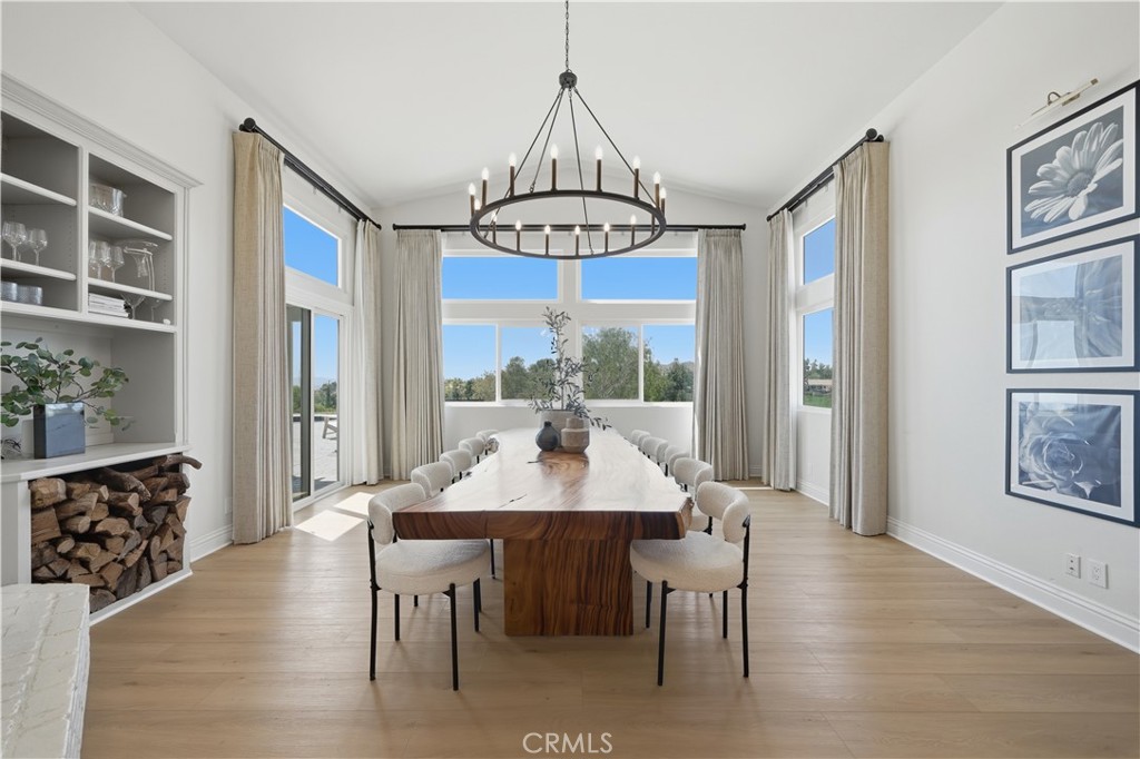 41110 Los Ranchos Circle Temecula, CA 92592 - Photo 28 of 77 a view of a dining room with furniture window and wooden floor