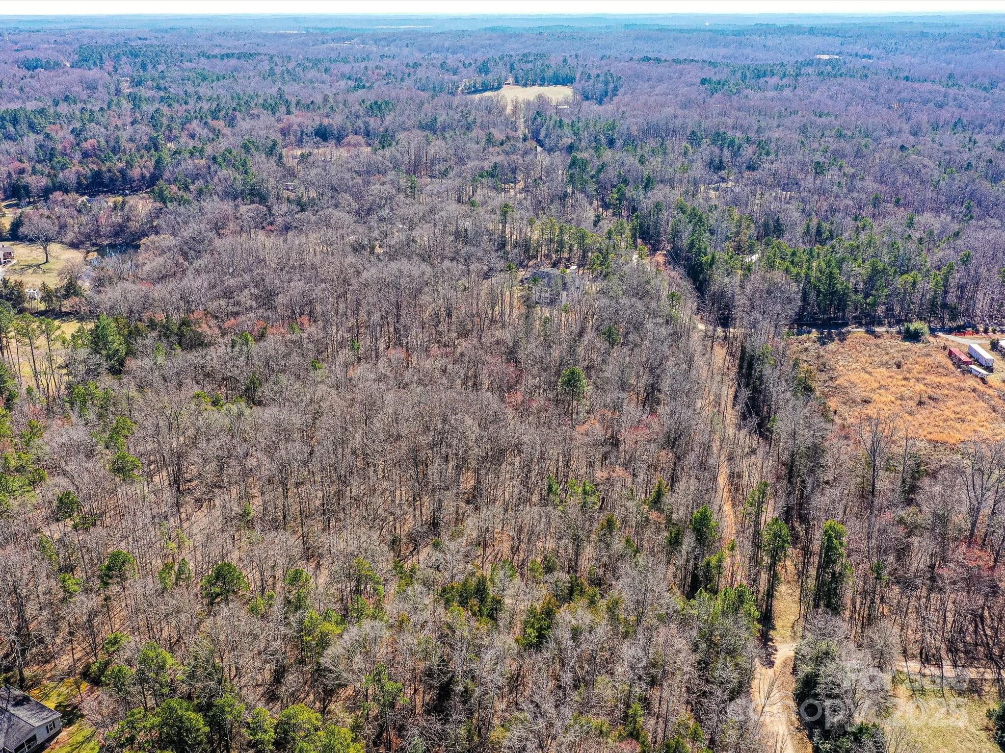 0 McElroy Road, Unit 168 Waxhaw, NC 28173 - Photo 21 of 32 an aerial view of house with yard and mountain view