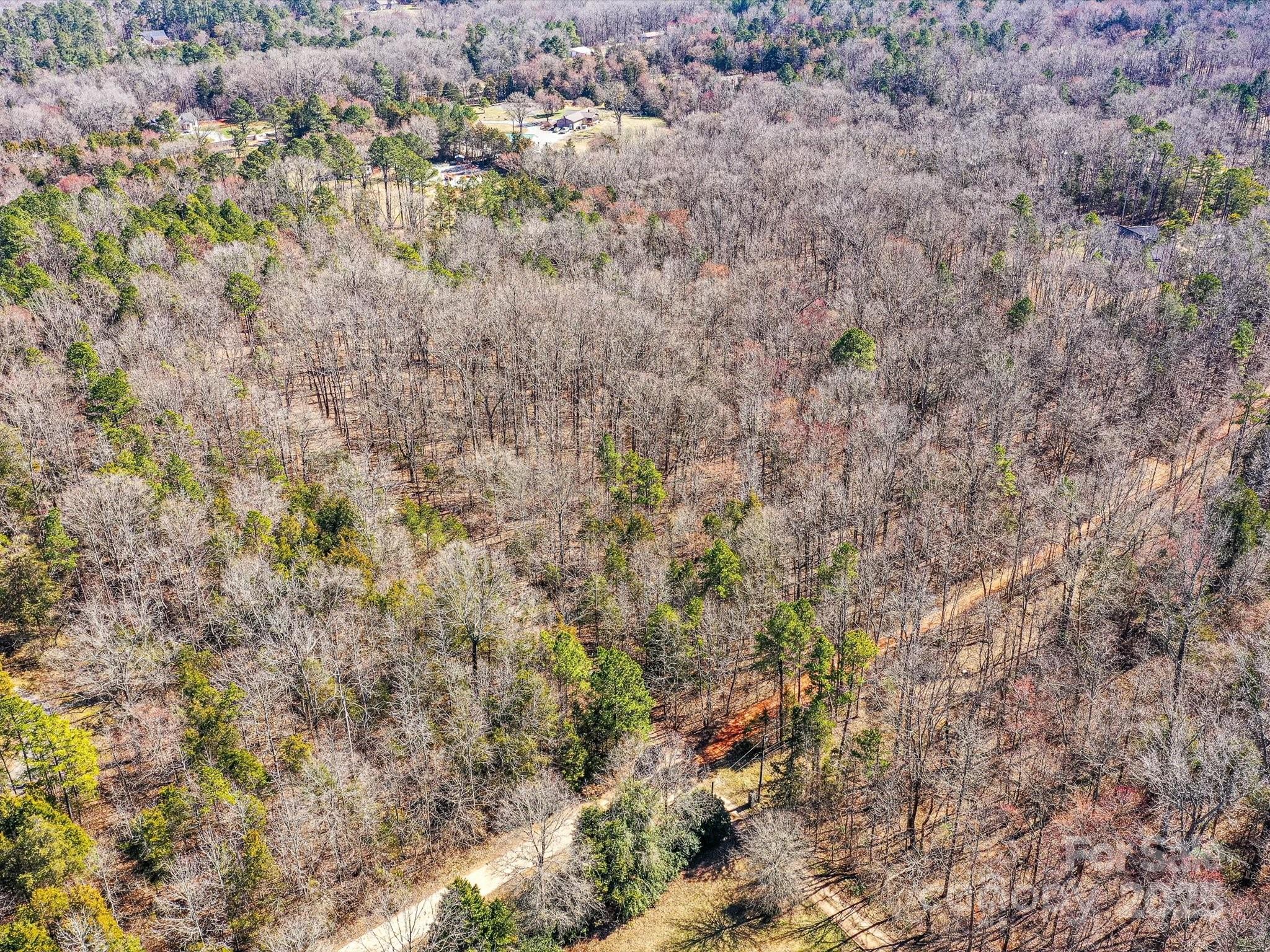0 McElroy Road, Unit 168 Waxhaw, NC 28173 - Photo 22 of 32 a view of a dry yard with green space