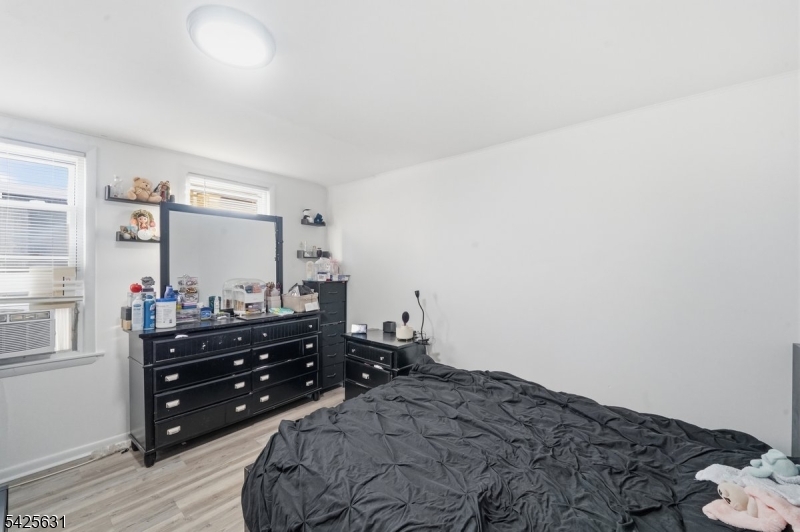 60 Westervelt Place Lodi, NJ 07644 - Photo 26 of 48 a bedroom with a bed and a window