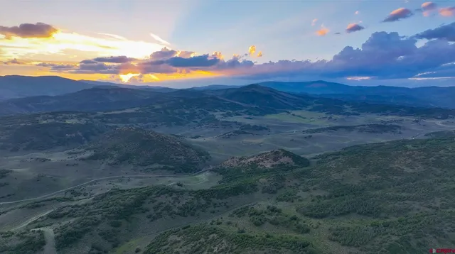 a view of sunset and yard