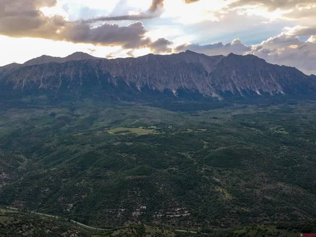 a view of mountains and mountain in the background