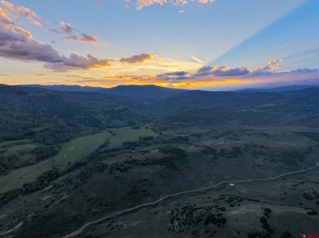 a view of an ocean and a mountain