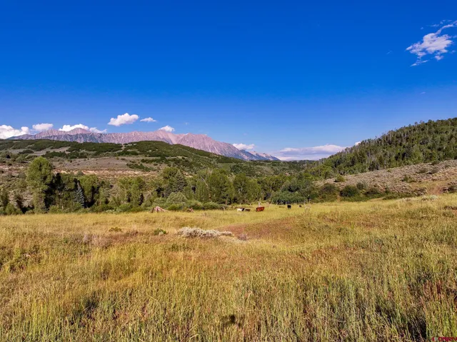 a view of an ocean beach and mountain