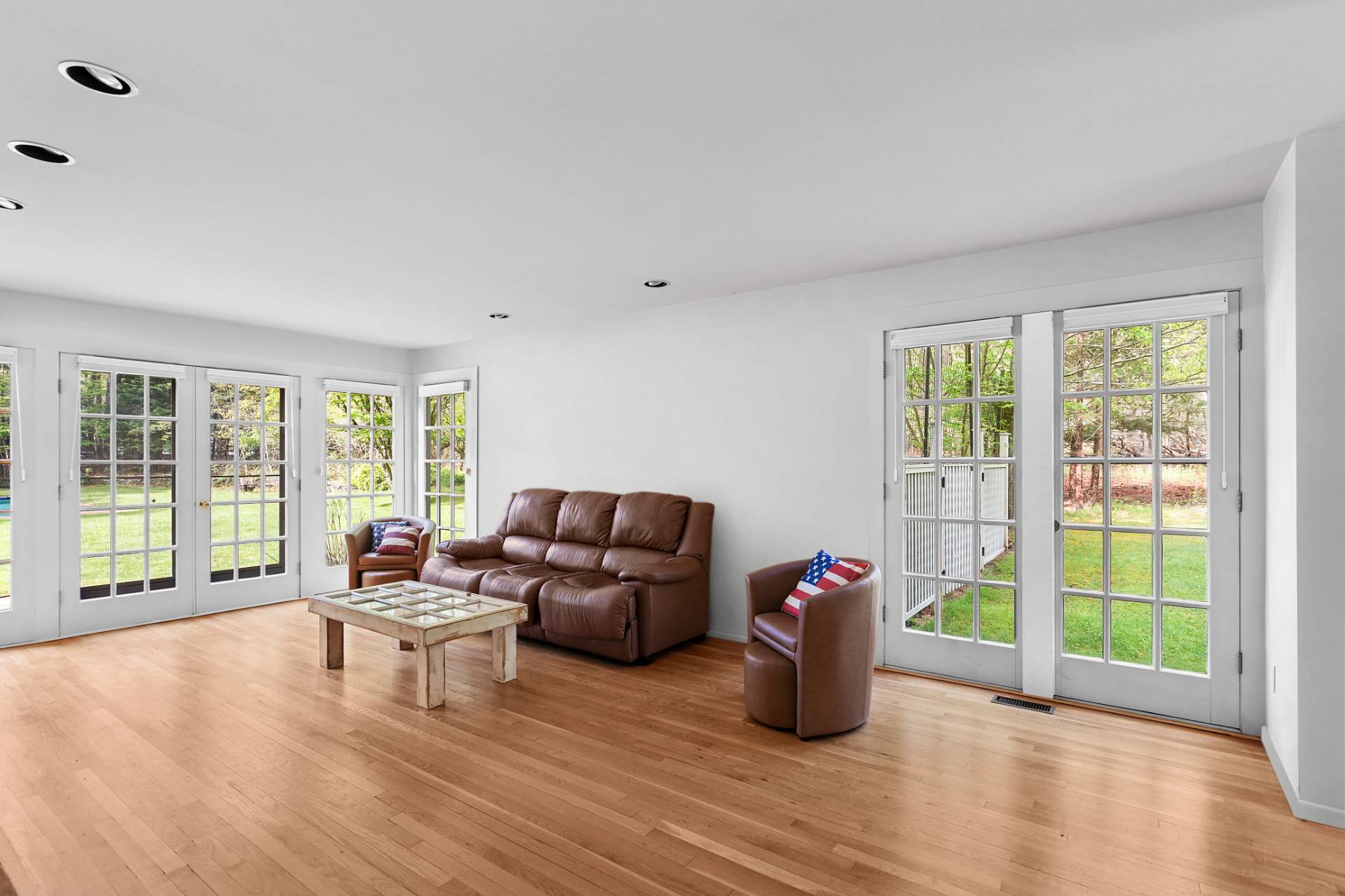 144 Hands Creek Road East Hampton, NY 11937 - Photo 12 of 32 a living room with furniture and a floor to ceiling window