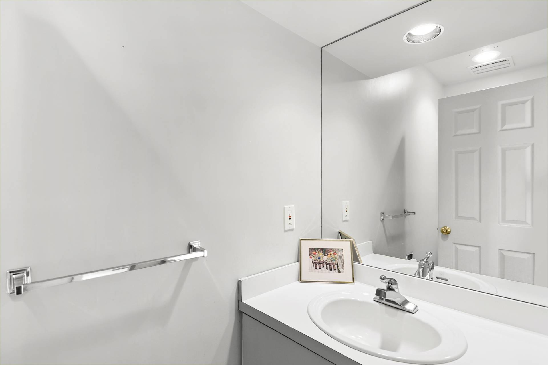 144 Hands Creek Road East Hampton, NY 11937 - Photo 15 of 32 a bathroom with a sink and a mirror