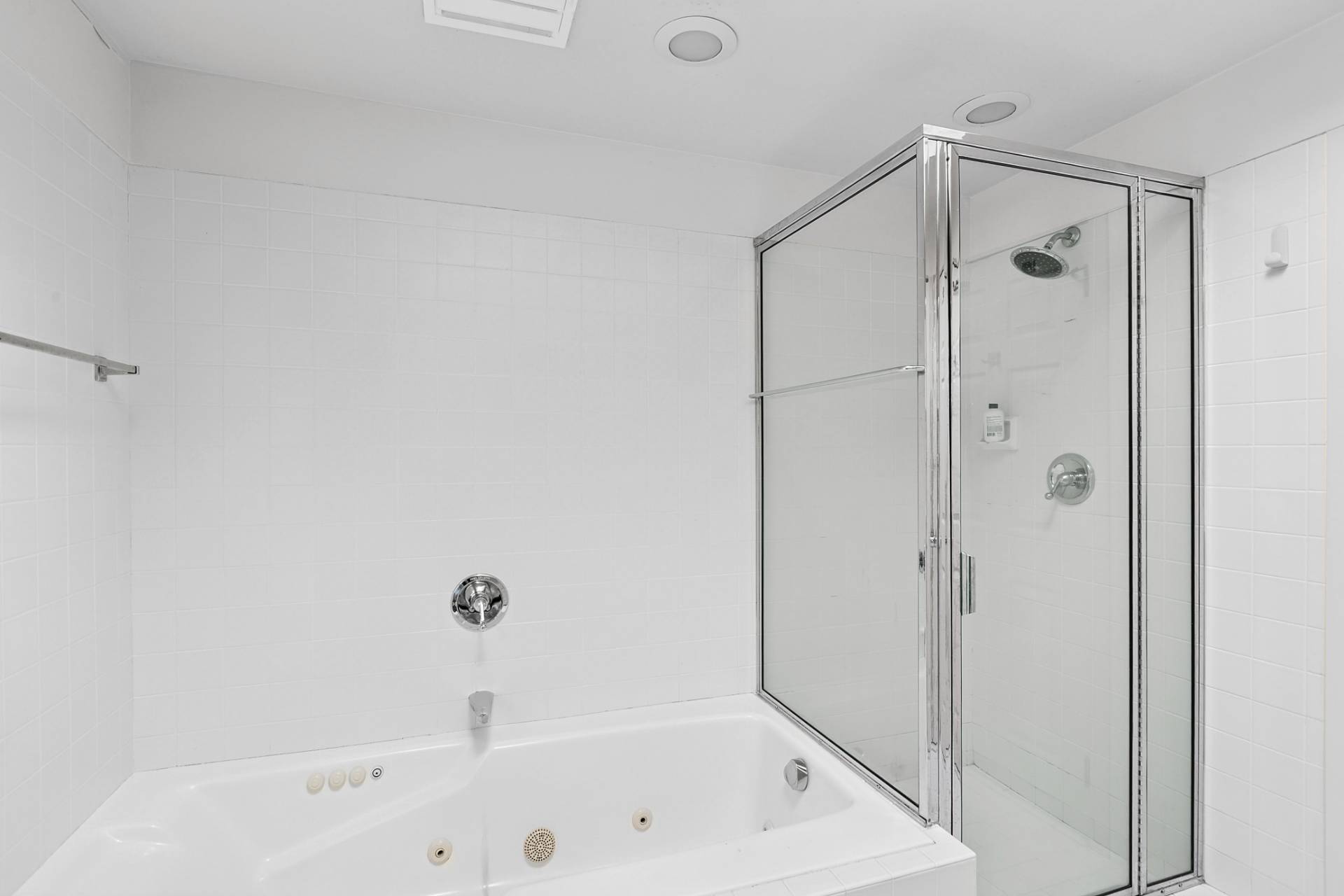 144 Hands Creek Road East Hampton, NY 11937 - Photo 20 of 32 a bathroom with a bathtub and a shower