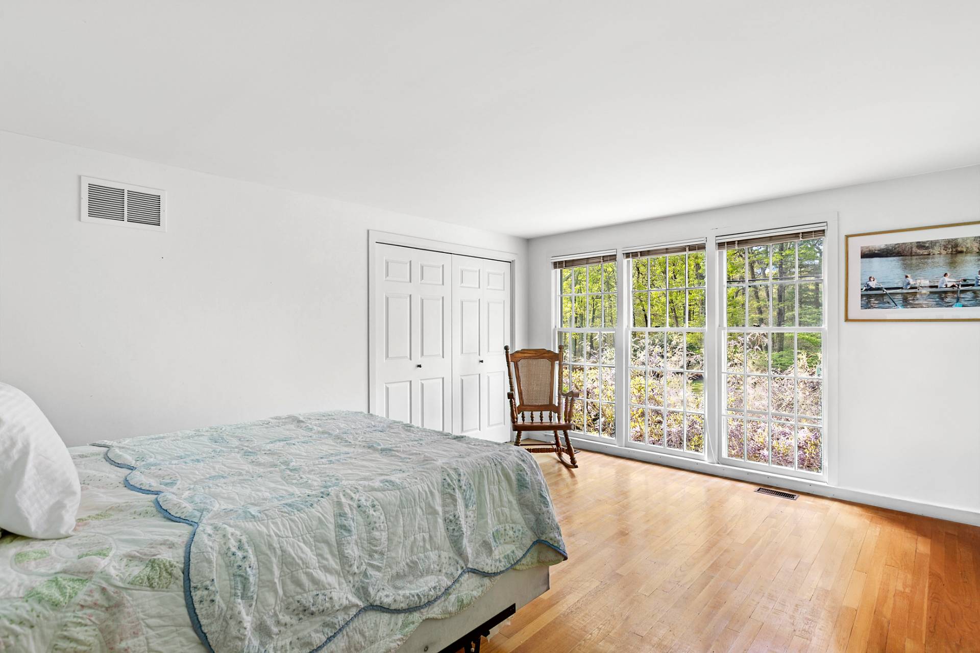 144 Hands Creek Road East Hampton, NY 11937 - Photo 21 of 32 a bed sitting in a bedroom next to a window