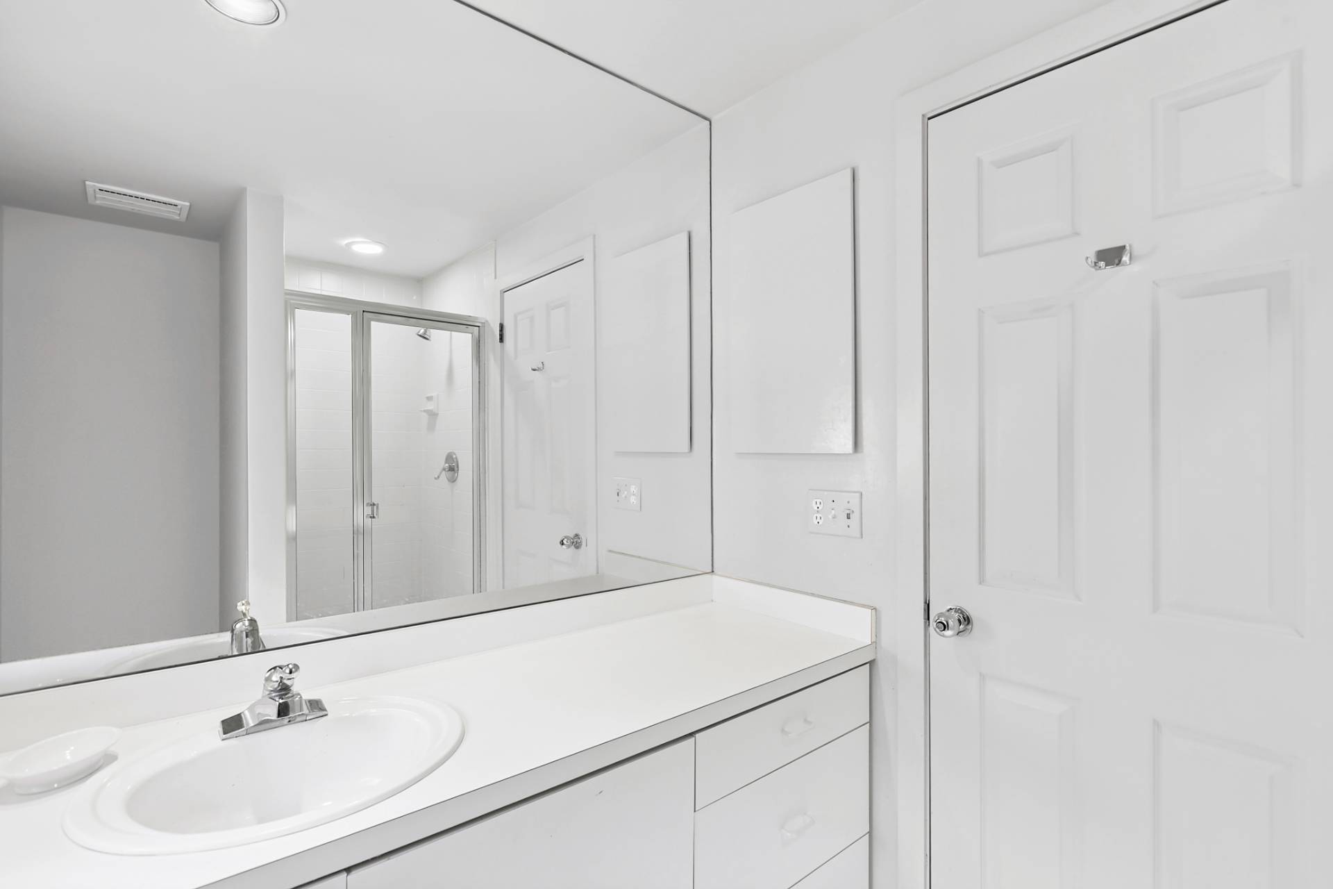 144 Hands Creek Road East Hampton, NY 11937 - Photo 24 of 32 a bathroom with a sink and a mirror